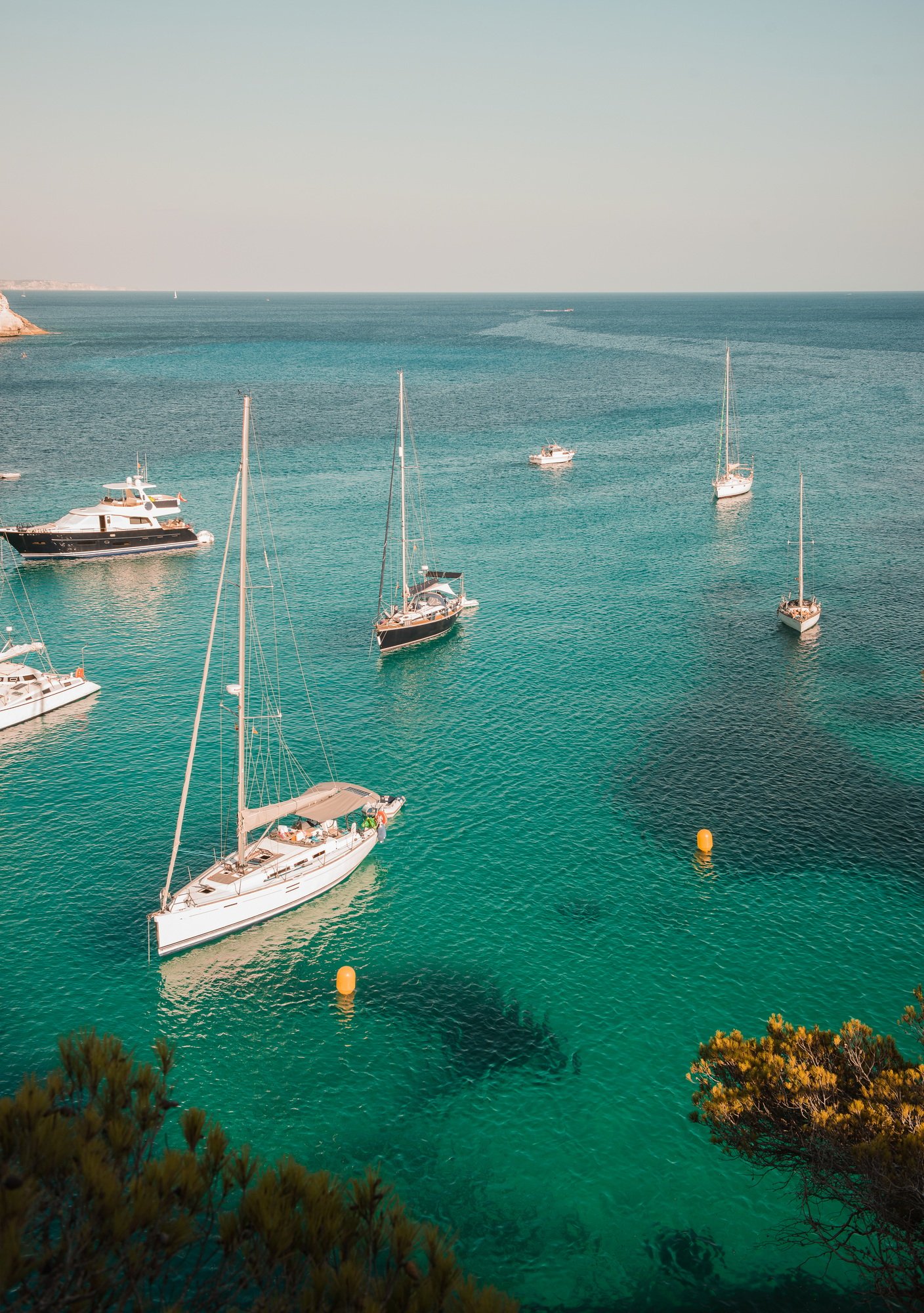 Yachts anchored in bay at Cala Macarella, Menorca, Spain